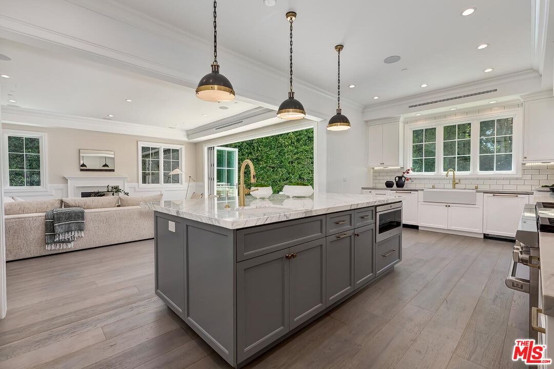 Fireplace, Interior, Kitchen, Living room, Pendant Lights, Recessed Lighting, Stainless Steel Appliances, Wood Texture Flooring