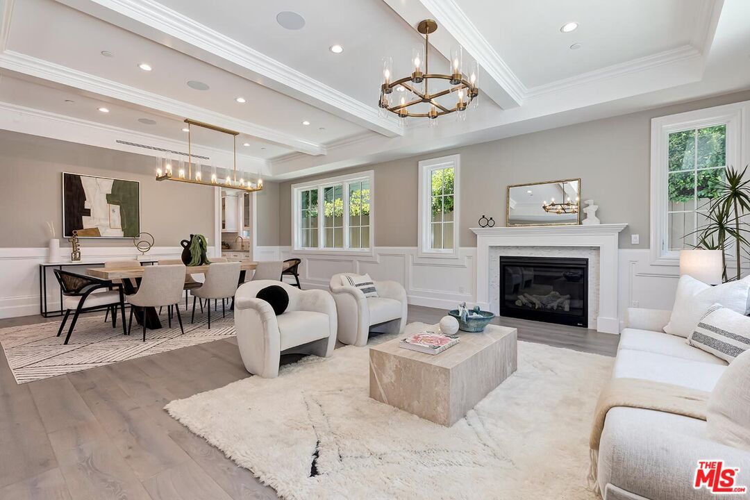 Chandelier, Dining room, Fireplace, Interior, Living room, Pendant Lights, Recessed Lighting, Wood Texture Flooring
