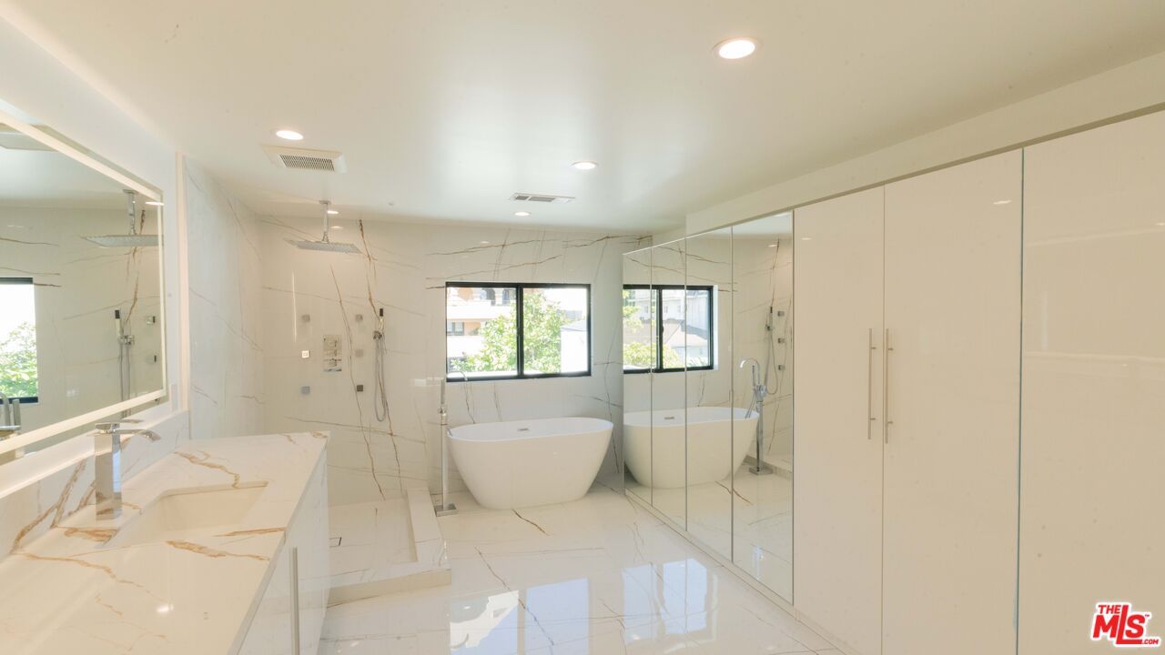 Bathroom, Dual Sink Vanities, Free Standing Baths, Glass Shower, Interior, Marble, Marble Walls, Recessed Lighting