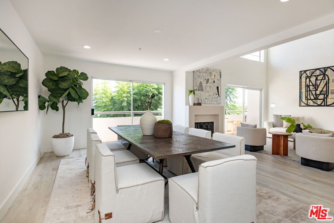 Dining room, Fireplace, Interior, Living room, Recessed Lighting, Wood Texture Flooring