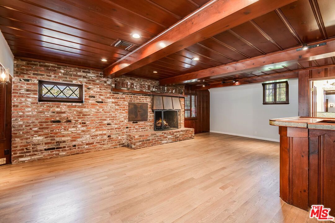 Empty room, Fireplace, Interior, Recessed Lighting, Stone Walls, Wooden Beams, Wooden Ceilings, Wood Texture Flooring