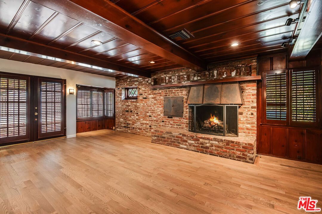 Empty room, Fireplace, Interior, Recessed Lighting, Stone Walls, Wooden Beams, Wooden Ceilings, Wood Texture Flooring