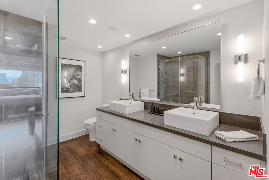 Bathroom, Dual Sink Vanities, Glass Shower, Interior, Recessed Lighting, Wood Texture Flooring