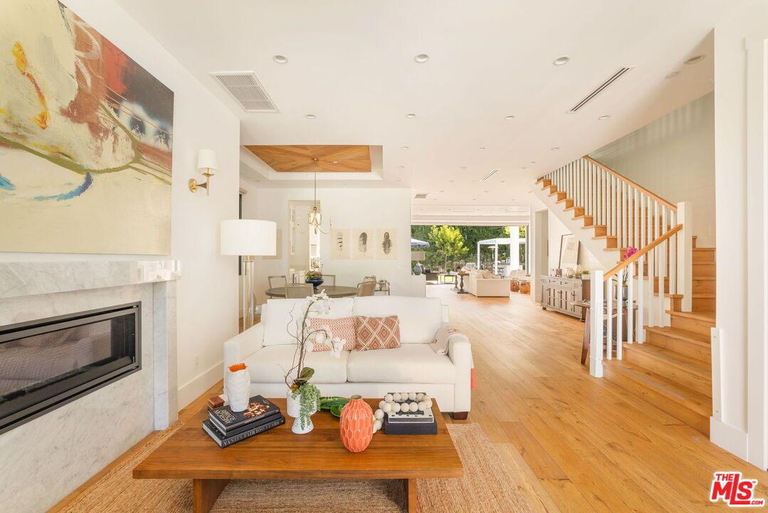 Dining room, Fireplace, Interior, Living room, Pendant Lights, Recessed Lighting, Wood Texture Flooring