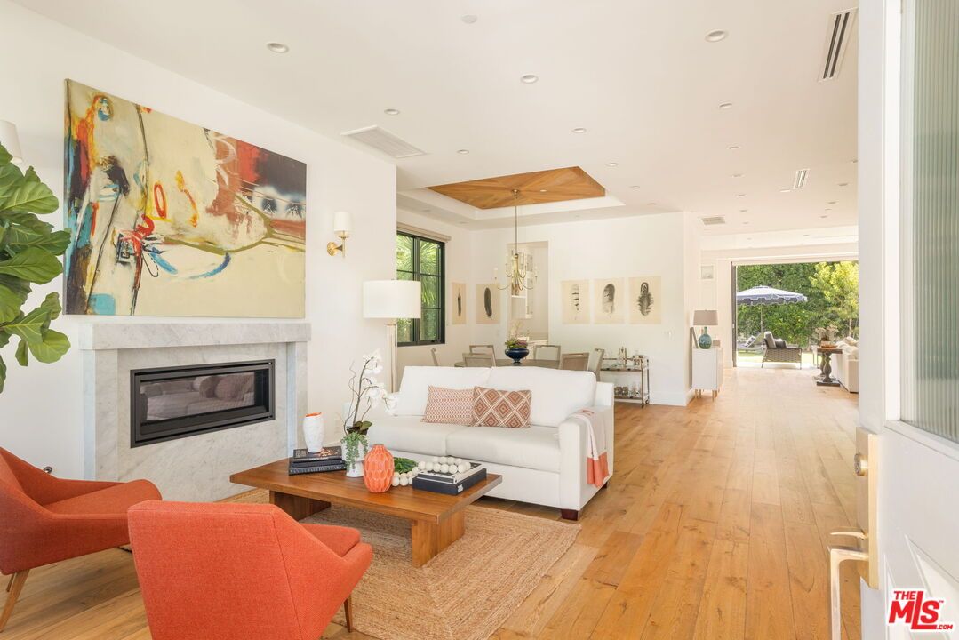 Chandelier, Dining room, Fireplace, Interior, Living room, Pendant Lights, Recessed Lighting, Wooden Ceilings, Wood Texture Flooring