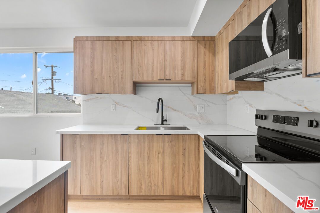 Interior, Kitchen, Marble Walls, Stainless Steel Appliances, Wood Texture Flooring