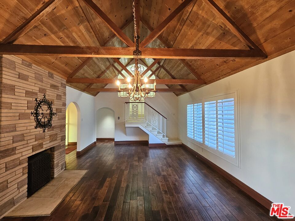 Chandelier, Empty room, Fireplace, Interior, Stone Walls, Wooden Beams, Wooden Ceilings, Wood Texture Flooring