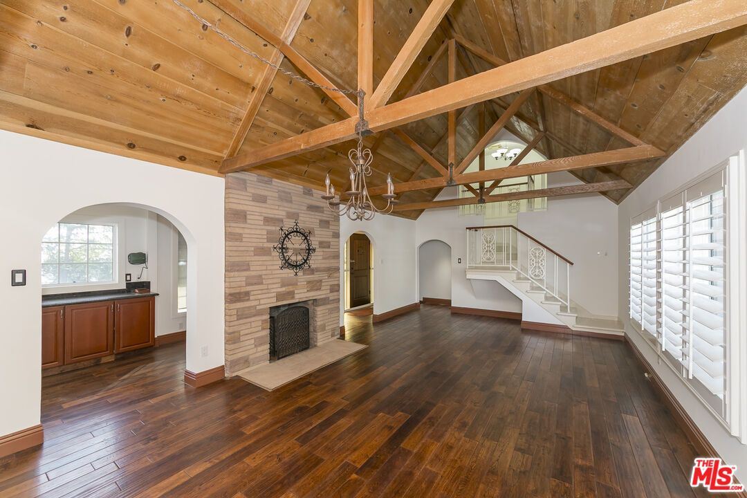 Chandelier, Empty room, Fireplace, Interior, Stone Walls, Wooden Beams, Wooden Ceilings, Wood Texture Flooring