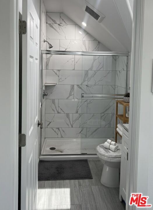 Bathroom, Glass Shower, Interior, Marble Walls, Recessed Lighting, Wood Texture Flooring