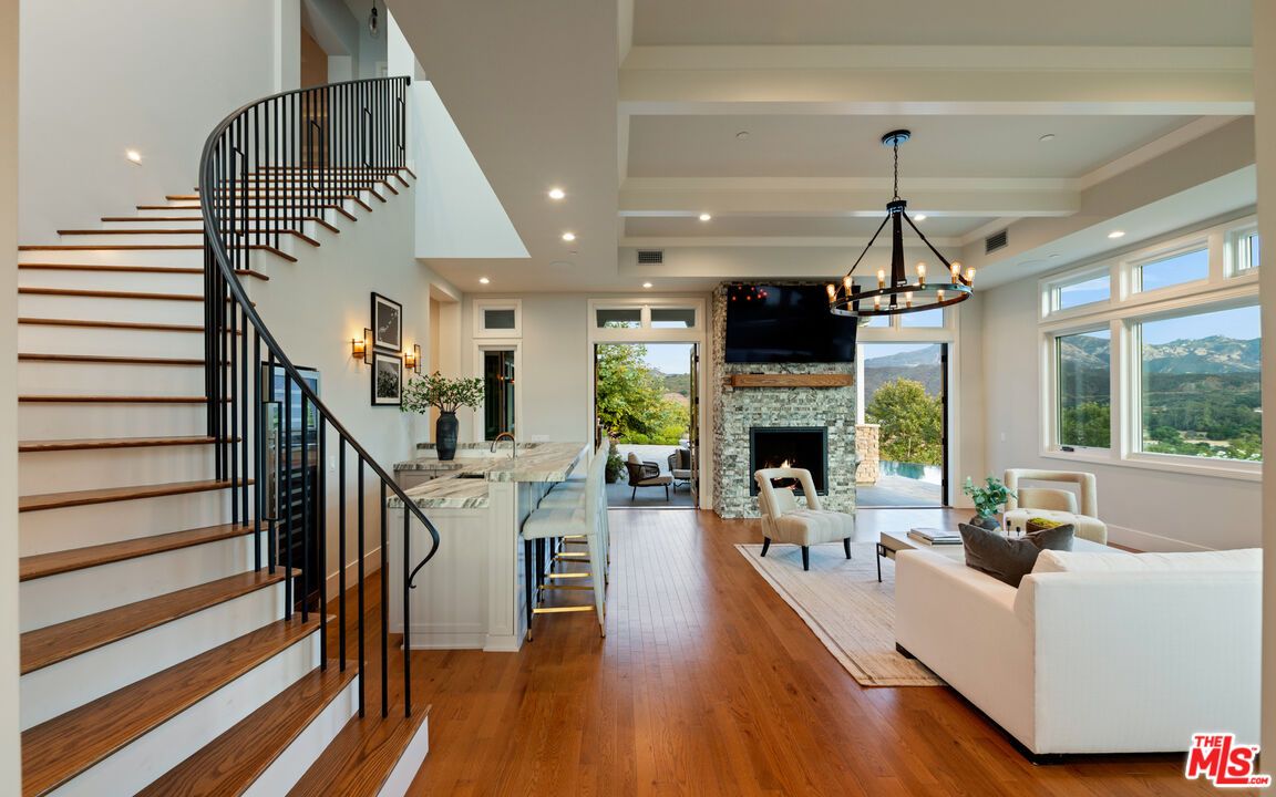 Chandelier, Fireplace, Interior, Living room, Recessed Lighting, Wood Texture Flooring