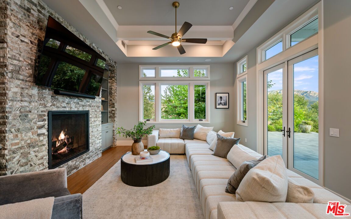 Fireplace, Interior, Living room, Recessed Lighting, Stone Walls, Wood Texture Flooring