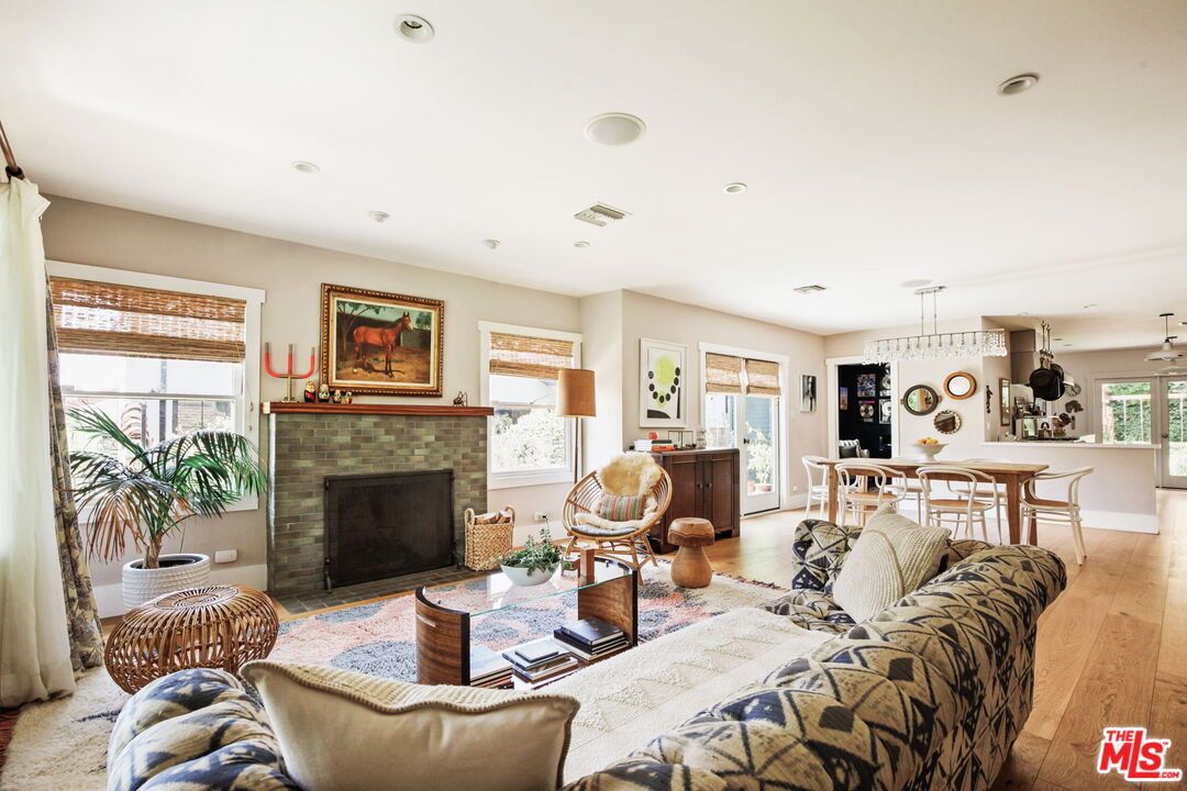 Dining room, Fireplace, Interior, Living room, Pendant Lights, Recessed Lighting, Wood Texture Flooring