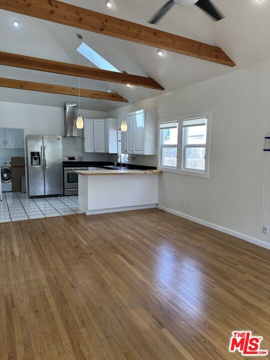 Empty room, Interior, Kitchen, Pendant Lights, Recessed Lighting, Stainless Steel Appliances, Wooden Beams, Wood Texture Flooring