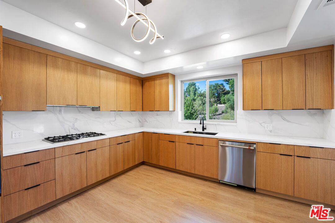 Interior, Kitchen, Marble Walls, Pendant Lights, Recessed Lighting, Stainless Steel Appliances, Wood Texture Flooring