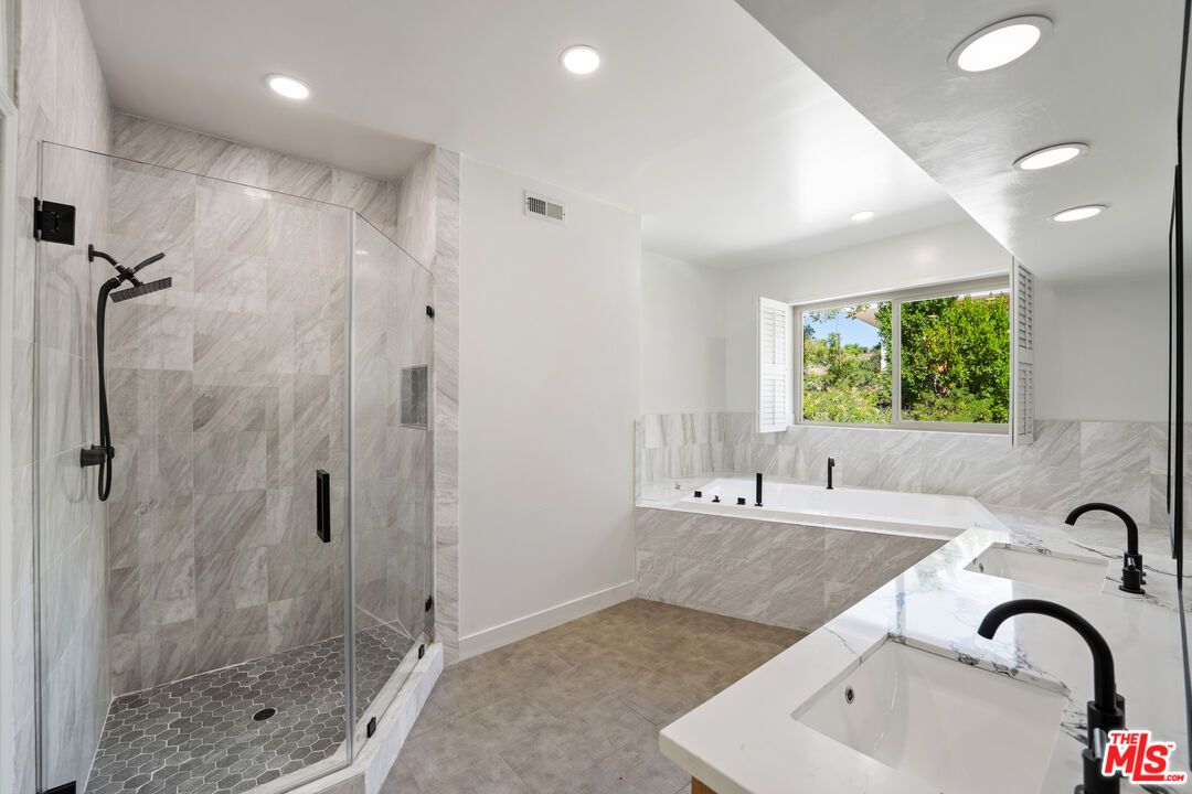 Bathroom, Dual Sink Vanities, Glass Shower, Interior, Marble Walls, Recessed Lighting