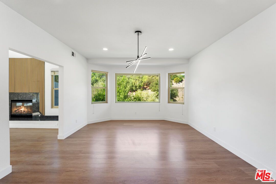 Empty room, Fireplace, Interior, Pendant Lights, Recessed Lighting, Wood Texture Flooring
