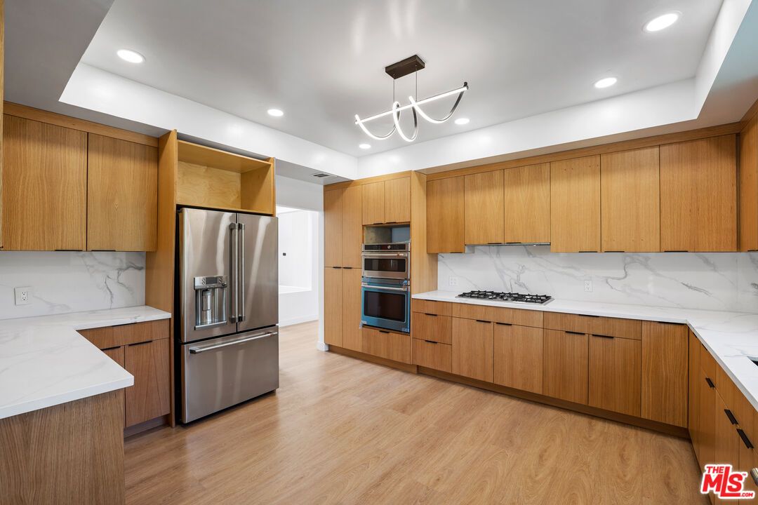 Interior, Kitchen, Marble Walls, Pendant Lights, Recessed Lighting, Stainless Steel Appliances, Wood Texture Flooring