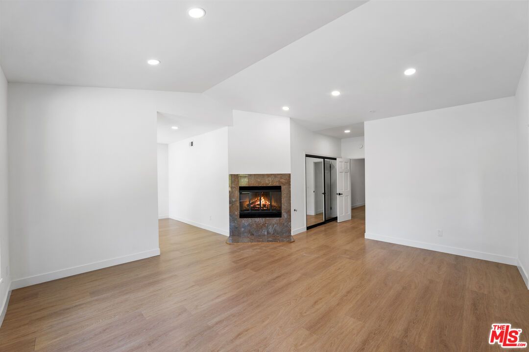 Empty room, Fireplace, Interior, Recessed Lighting, Wood Texture Flooring