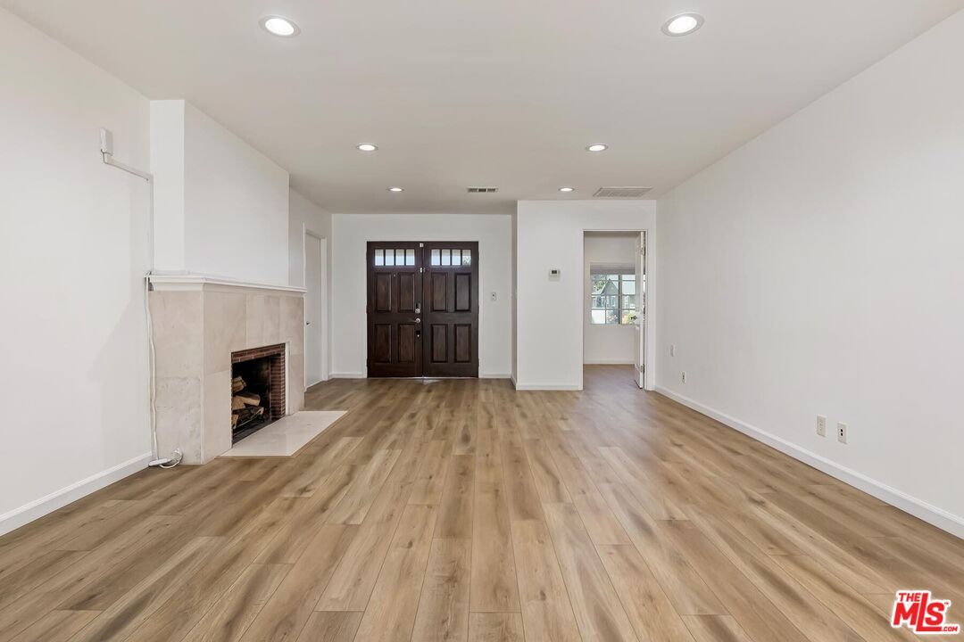 Empty room, Fireplace, Interior, Recessed Lighting, Wood Texture Flooring