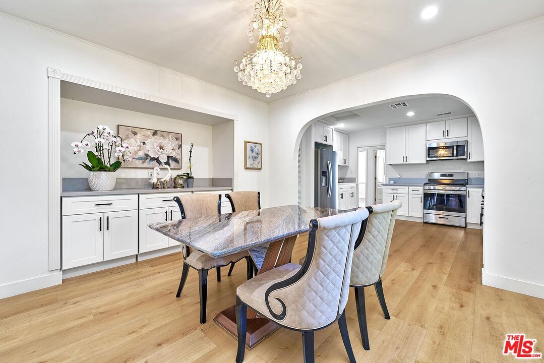 Chandelier, Dining room, Interior, Kitchen, Recessed Lighting, Stainless Steel Appliances, Wood Texture Flooring