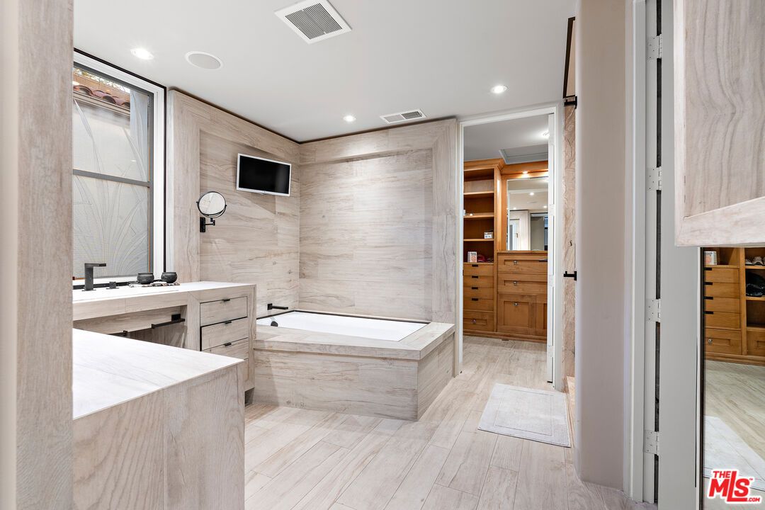 Bathroom, Dual Sink Vanities, Interior, Marble Walls, Recessed Lighting, Wood Texture Flooring