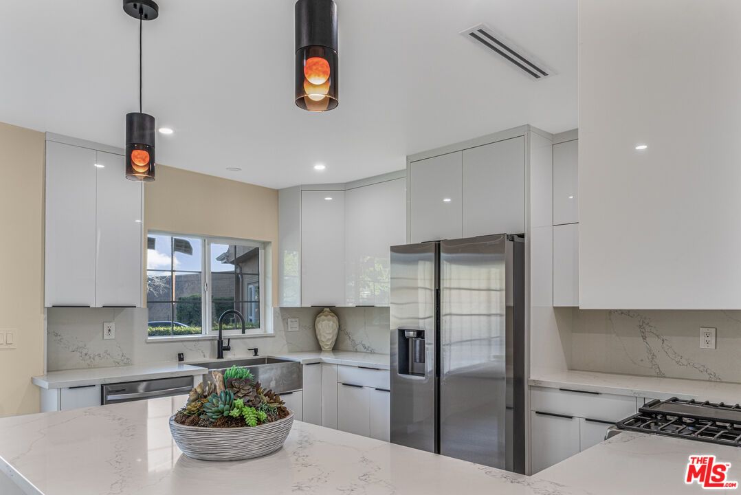 Interior, Kitchen, Marble Walls, Pendant Lights, Recessed Lighting, Stainless Steel Appliances