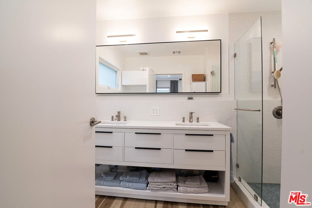 Bathroom, Dual Sink Vanities, Glass Shower, Interior, Wood Texture Flooring
