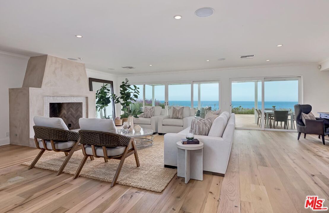 Fireplace, Interior, Living room, Recessed Lighting, Water, Wood Texture Flooring