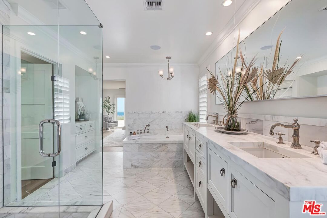 Bathroom, Dual Sink Vanities, Glass Shower, Interior, Marble, Marble Walls, Pendant Lights, Recessed Lighting