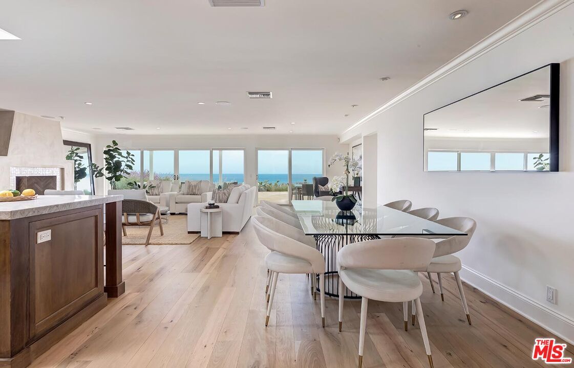 Dining room, Fireplace, Interior, Living room, Recessed Lighting, Water, Wood Texture Flooring