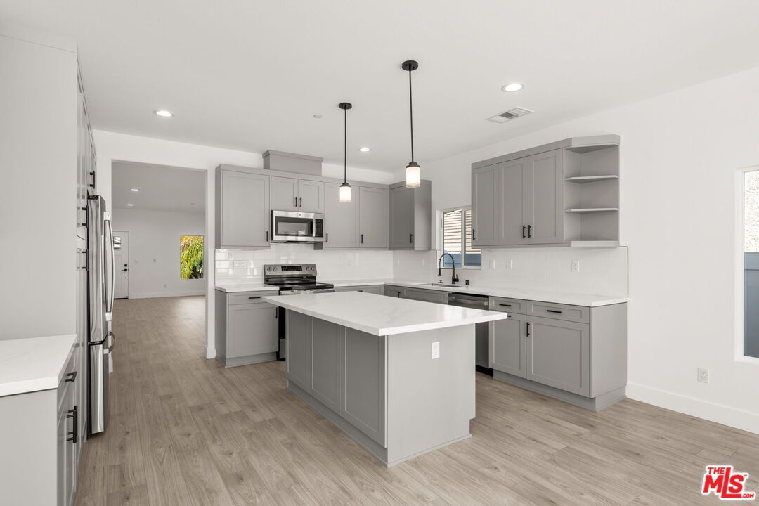 Interior, Kitchen, Pendant Lights, Recessed Lighting, Stainless Steel Appliances, Wood Texture Flooring