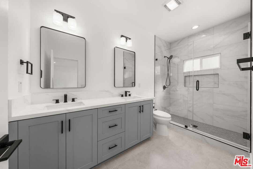 Bathroom, Dual Sink Vanities, Glass Shower, Interior, Marble Walls, Recessed Lighting
