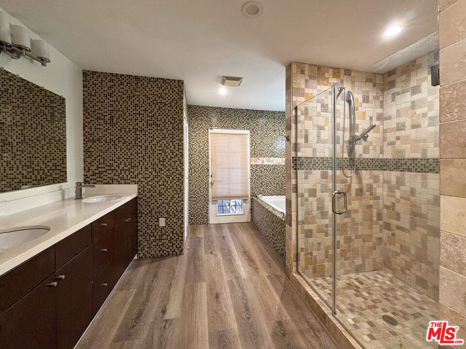 Bathroom, Dual Sink Vanities, Glass Shower, Interior, Recessed Lighting, Wood Texture Flooring
