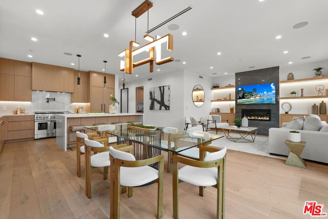 Dining room, Fireplace, Interior, Kitchen, Living room, Pendant Lights, Recessed Lighting, Stainless Steel Appliances, Wood Texture Flooring