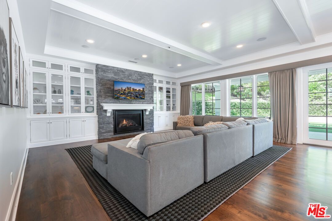 Fireplace, Interior, Living room, Recessed Lighting, Stone Walls, Wood Texture Flooring