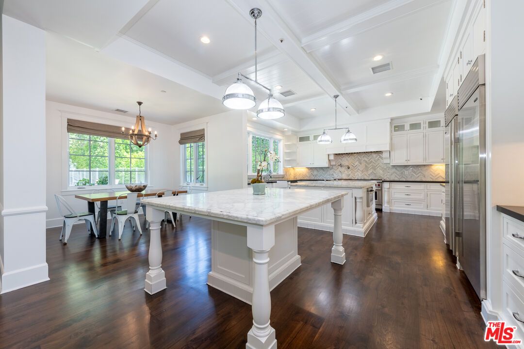 Chandelier, Dining room, Interior, Kitchen, Pendant Lights, Recessed Lighting, Stainless Steel Appliances, Wood Texture Flooring