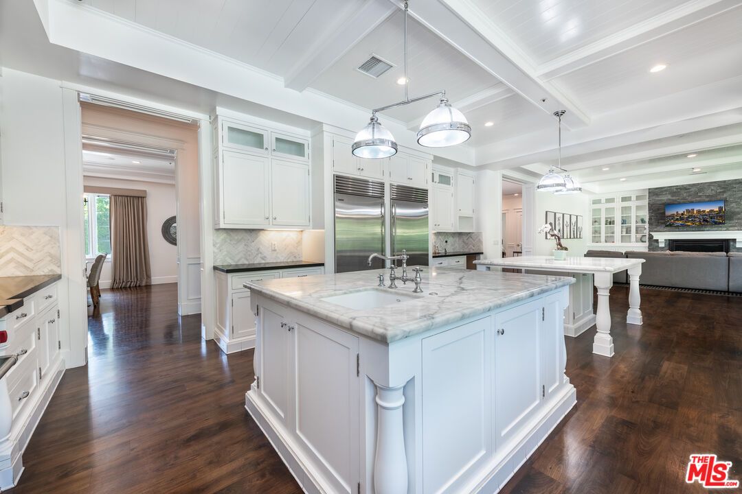 Fireplace, Interior, Kitchen, Living room, Pendant Lights, Recessed Lighting, Stainless Steel Appliances, Wood Texture Flooring