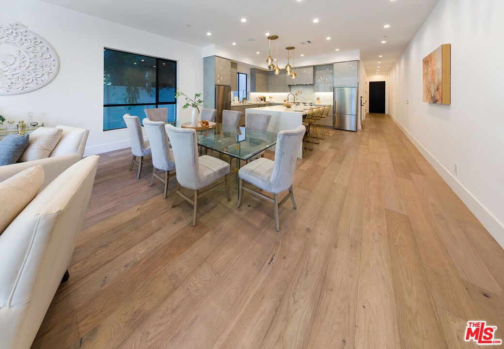 Dining room, Interior, Kitchen, Pendant Lights, Recessed Lighting, Stainless Steel Appliances, Wood Texture Flooring