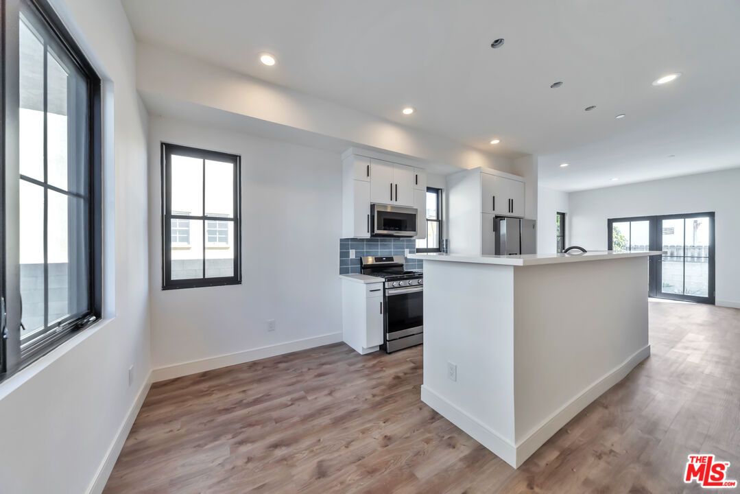 Interior, Kitchen, Recessed Lighting, Stainless Steel Appliances, Wood Texture Flooring