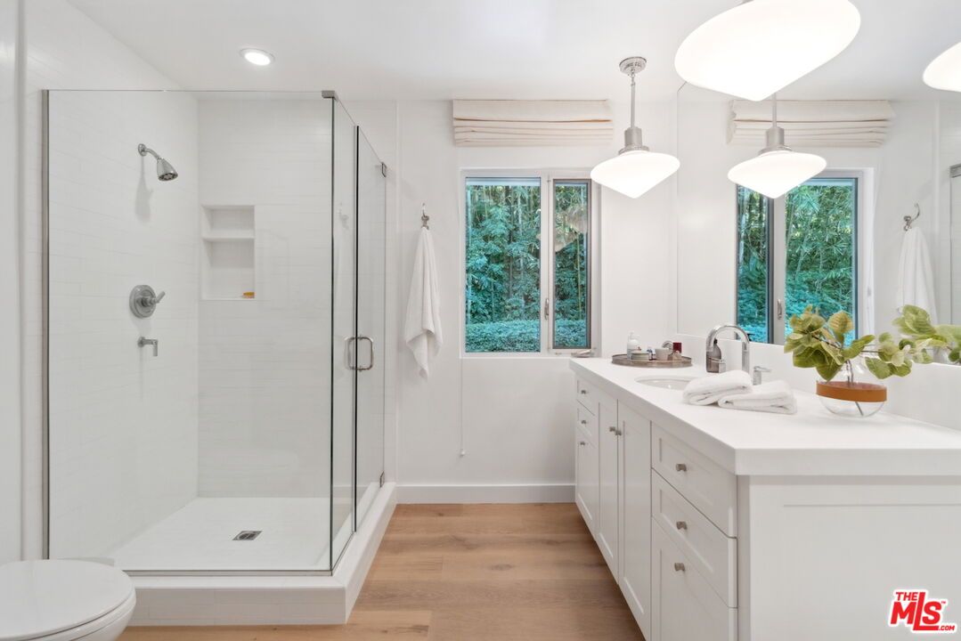 Bathroom, Dual Sink Vanities, Glass Shower, Interior, Pendant Lights, Recessed Lighting, Wood Texture Flooring