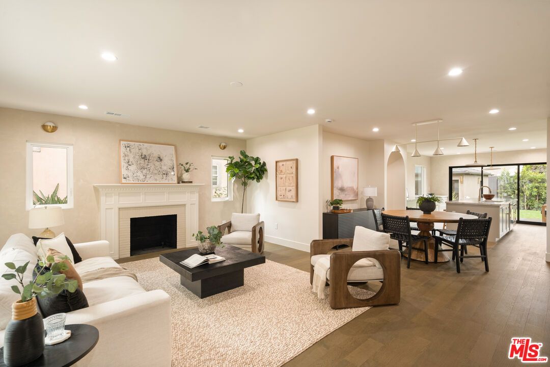Dining room, Fireplace, Interior, Living room, Pendant Lights, Recessed Lighting, Wood Texture Flooring