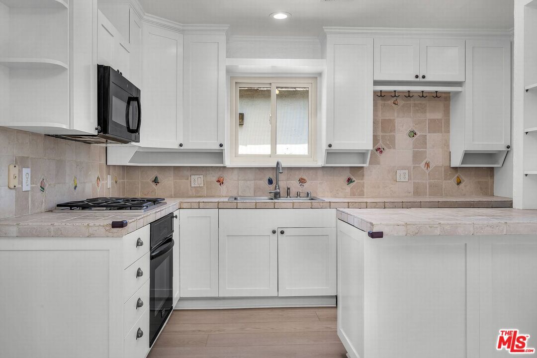 Interior, Kitchen, Recessed Lighting, Tile Countertops, Wood Texture Flooring