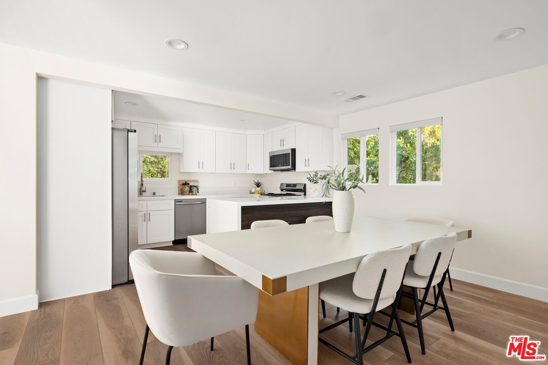 Dining room, Interior, Kitchen, Recessed Lighting, Stainless Steel Appliances, Wood Texture Flooring