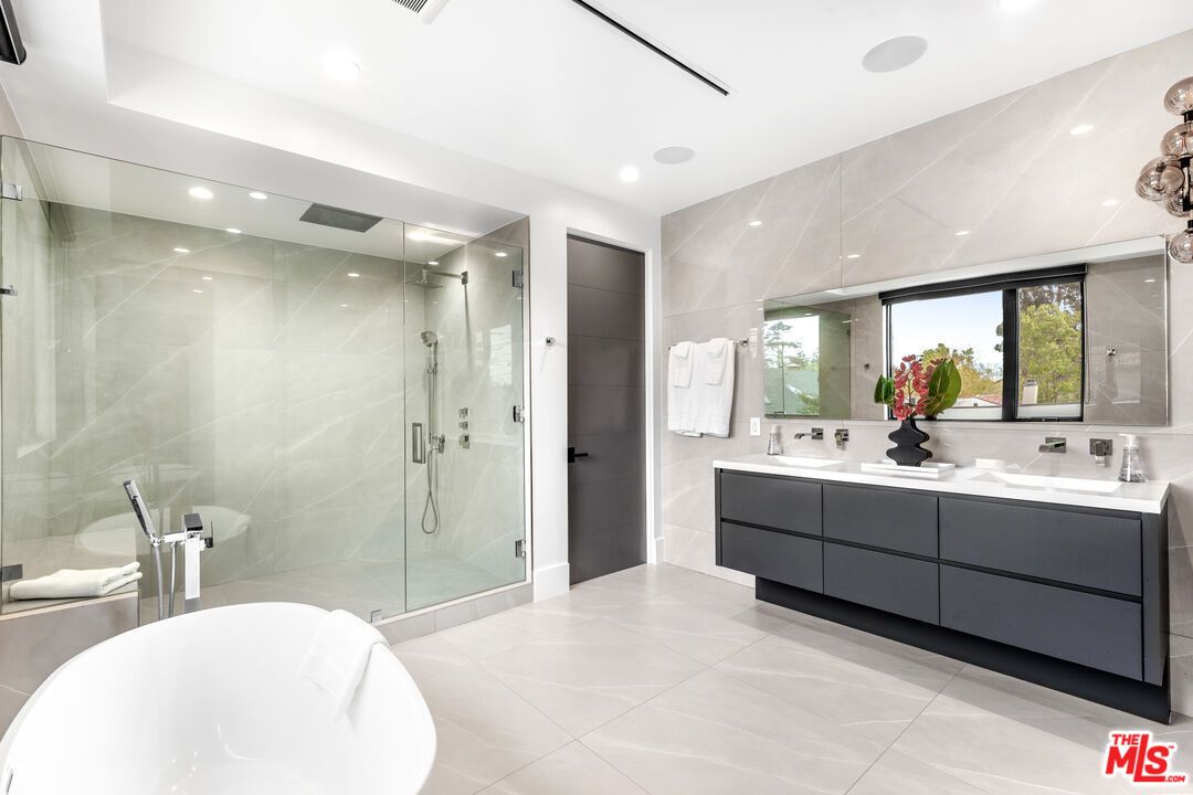 Bathroom, Dual Sink Vanities, Free Standing Baths, Glass Shower, Interior, Marble Walls, Recessed Lighting