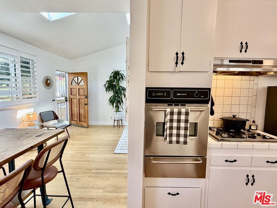 Interior, Kitchen, Stainless Steel Appliances, Tile Countertops, Wood Texture Flooring