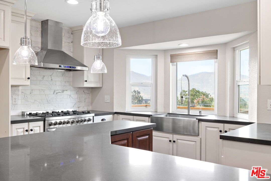 Interior, Kitchen, Marble Walls, Pendant Lights, Recessed Lighting, Stainless Steel Appliances