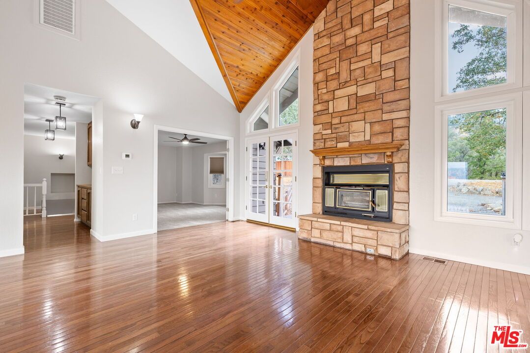 Empty room, Fireplace, Interior, Stone Walls, Wooden Ceilings, Wood Texture Flooring