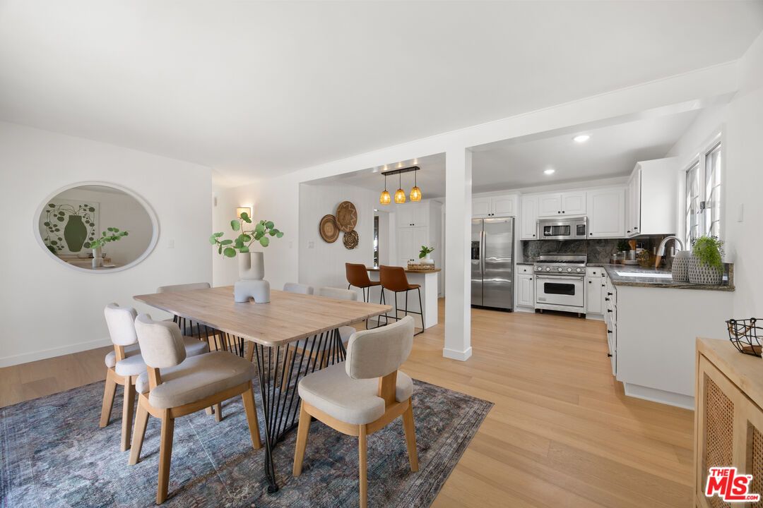 Dining room, Interior, Kitchen, Pendant Lights, Recessed Lighting, Stainless Steel Appliances, Wood Texture Flooring