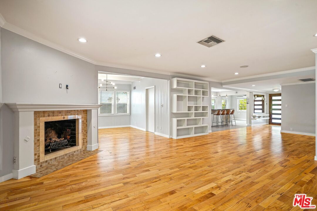 Dining room, Empty room, Fireplace, Interior, Pendant Lights, Recessed Lighting, Wood Texture Flooring