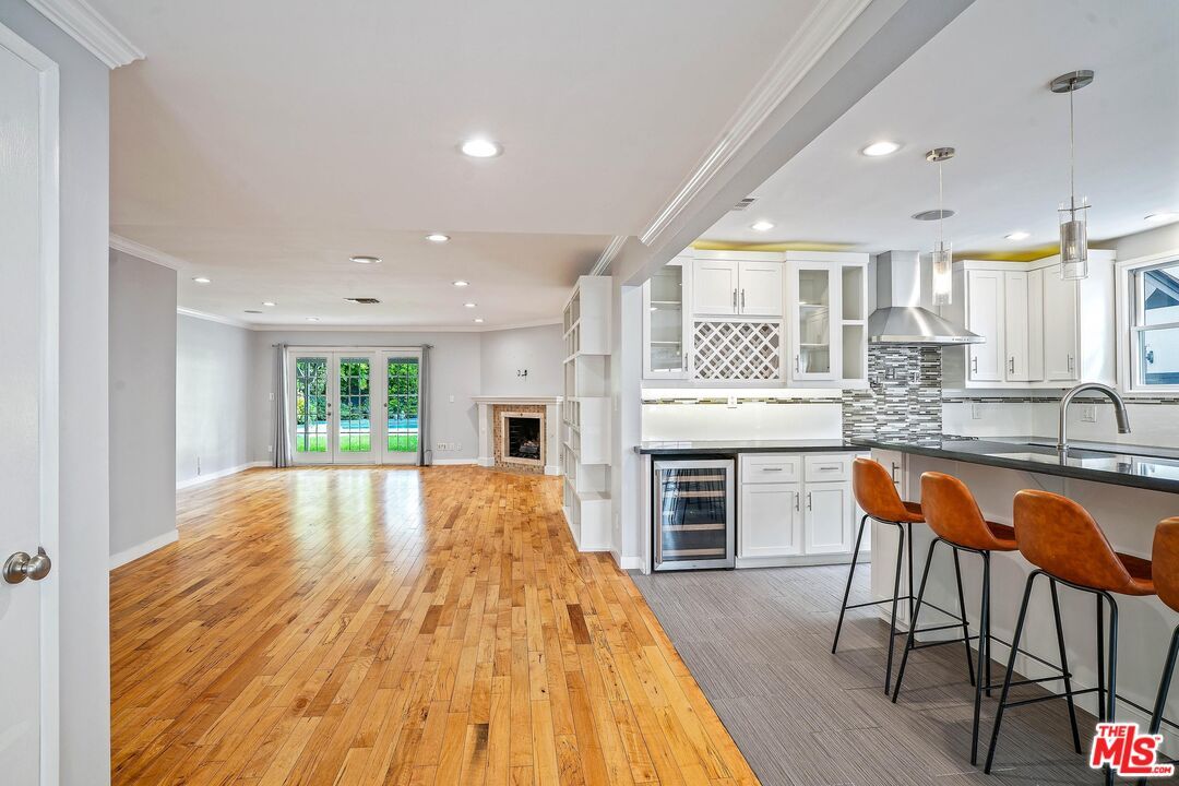 Fireplace, Interior, Kitchen, Pendant Lights, Recessed Lighting, Stainless Steel Appliances, Wood Texture Flooring